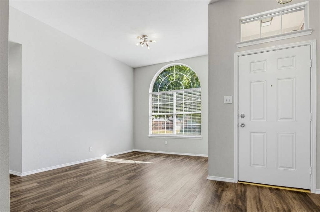 3408 Loblolly Lane, McKinney, TX 75070 The entry is flanked by the dining room and formal living room. LVP flooring extends throughout the main areas of the home and into the bedrooms.