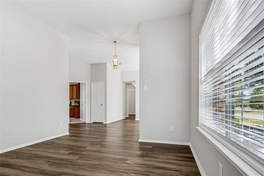 3408 Loblolly Lane, McKinney, TX 75070 View from formal living room looking toward the kitchen and the hallway with the 3 secondary bedrooms.