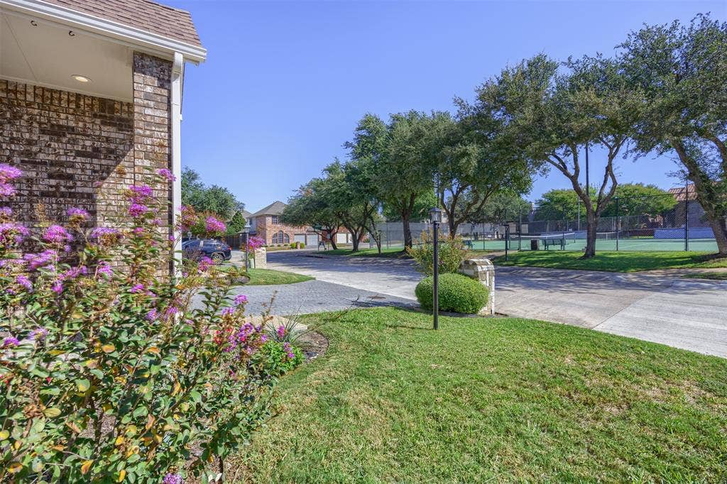 4203 N Capistrano Drive, Dallas, TX 75287 Front view of home looking across North Capistrano to tennis/pickleball courts.