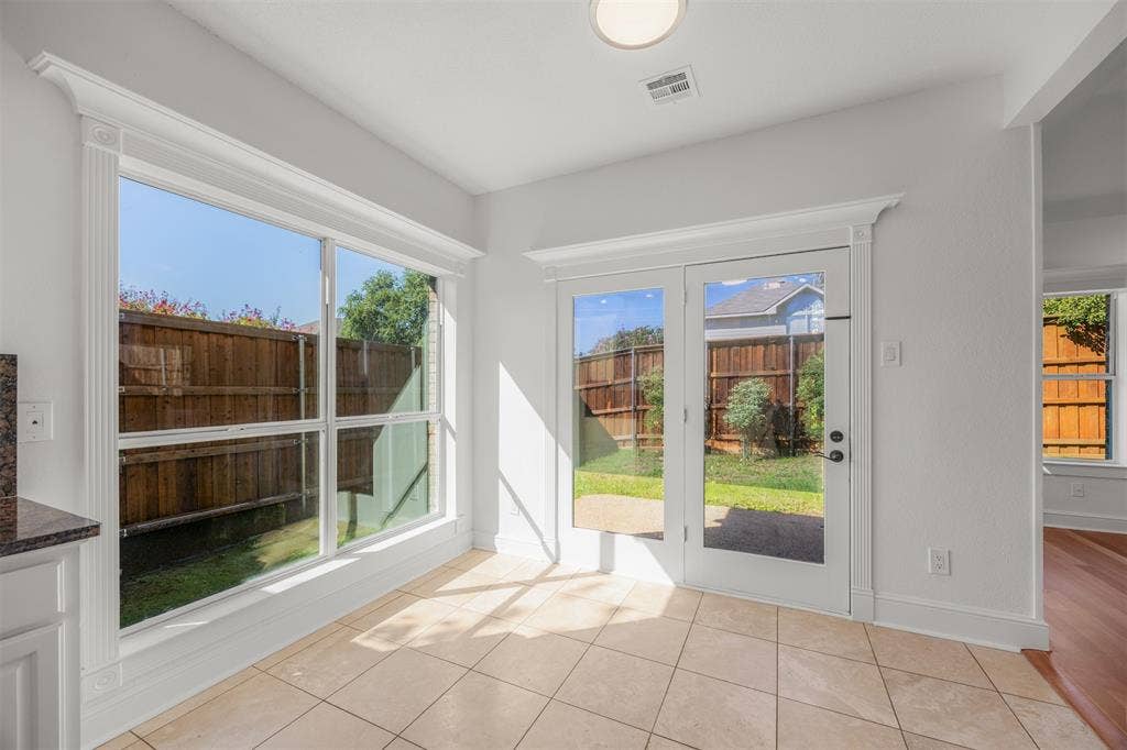 4203 N Capistrano Drive, Dallas, TX 75287 Travertine floors, custom trim surrounding windows and patio doors. New double insulated, low E glass has been installed.