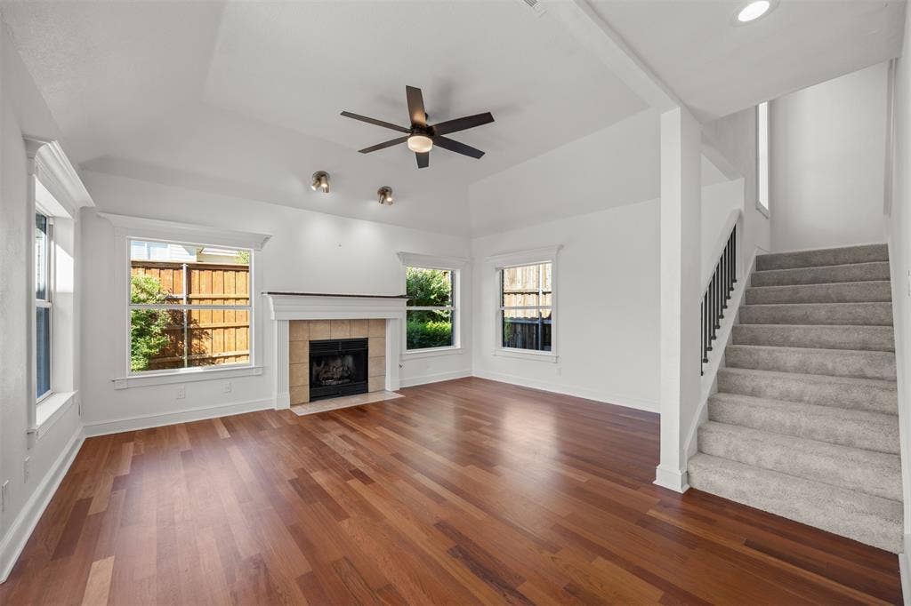 4203 N Capistrano Drive, Dallas, TX 75287 Photgraph taken from entrance hall into the living room showing stairs to 2nd floor on the right.