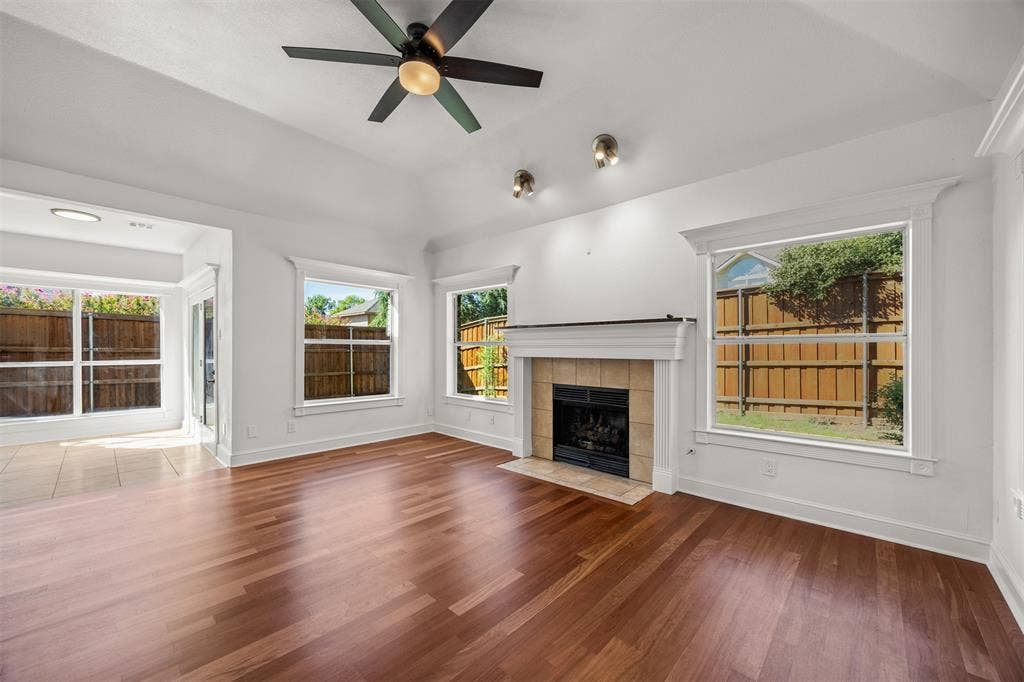 4203 N Capistrano Drive, Dallas, TX 75287 Beautiful solid Brazilian Cherry Wood, 3/4" x 3 1/4" installed over vapor barrier and 3/4" plywood. Gas Fireplace, Ceiling Fan, double insulated low E glass installed. Custom baseboards and window trim have been installed.