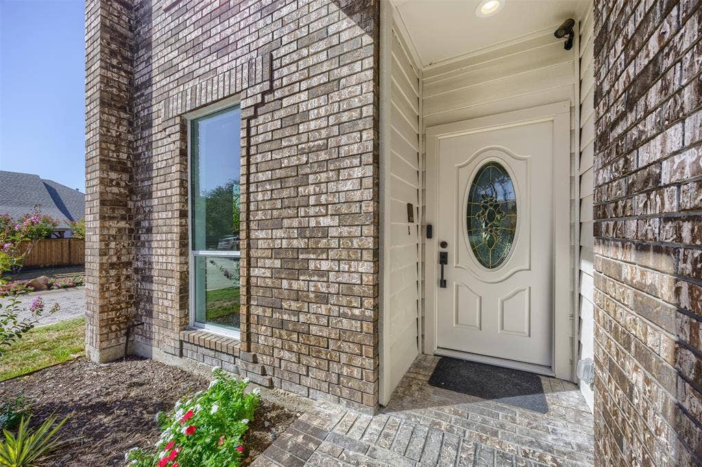 4203 N Capistrano Drive, Dallas, TX 75287 The covered entrance is approximately 6' with LED lighting and solid wood door with beveled glass.