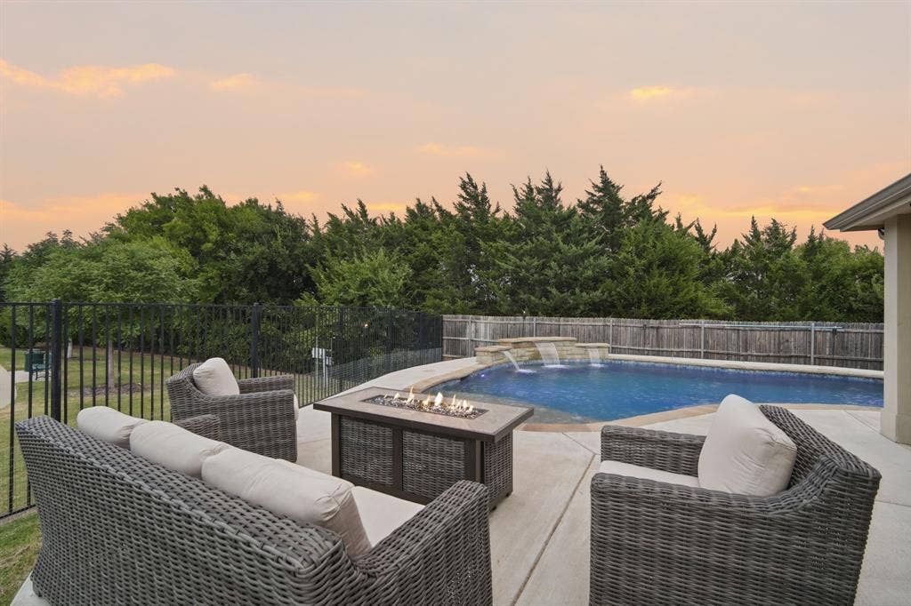 The outdoor living space is a true showstopper, designed for entertaining or peaceful relaxation