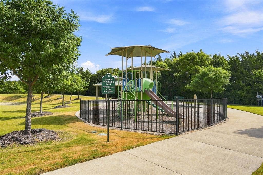 No need to build your own when you can step outside and enjoy this playground and green space with gazebo