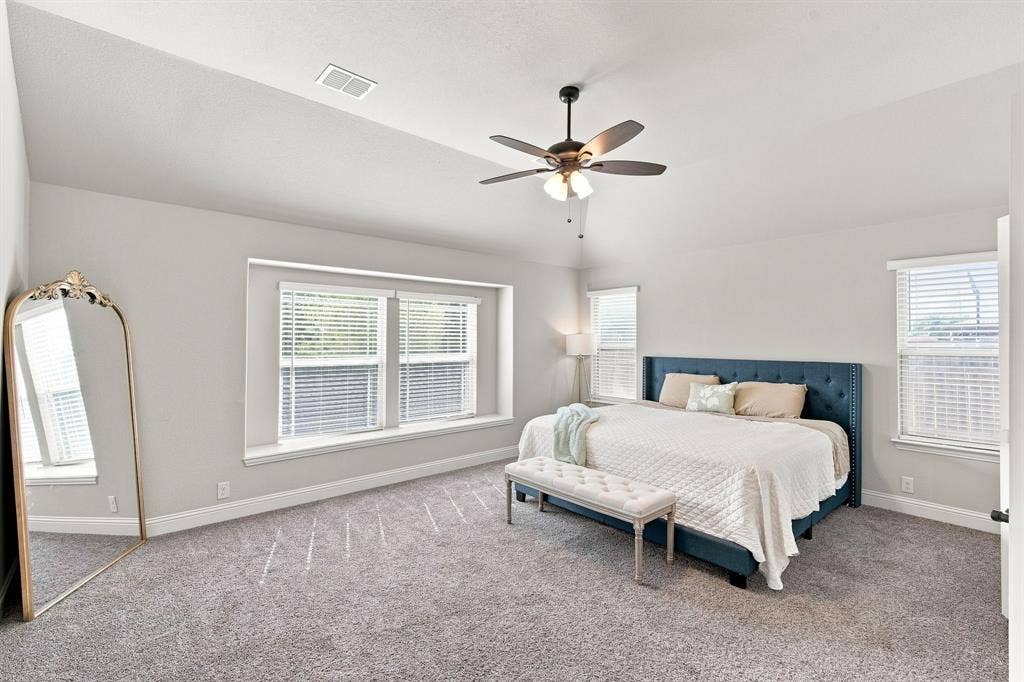 Enjoy spacious and cozy vibes in your primary bedroom