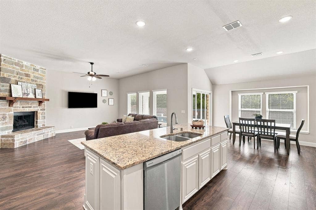 The gourmet island kitchen serves as the heart of the home