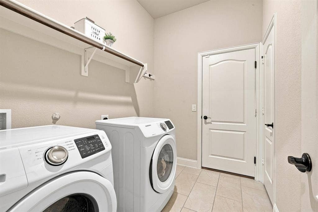 A separate laundry room hosts built-in mudroom storage