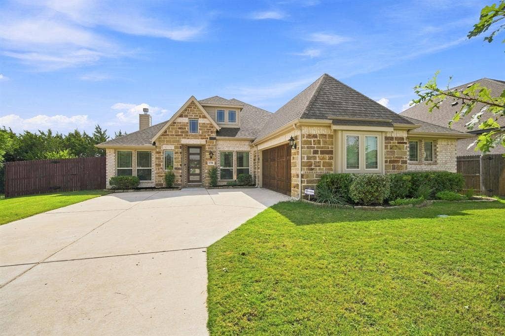 Striking J-swing driveway offers a beautiful elevation
