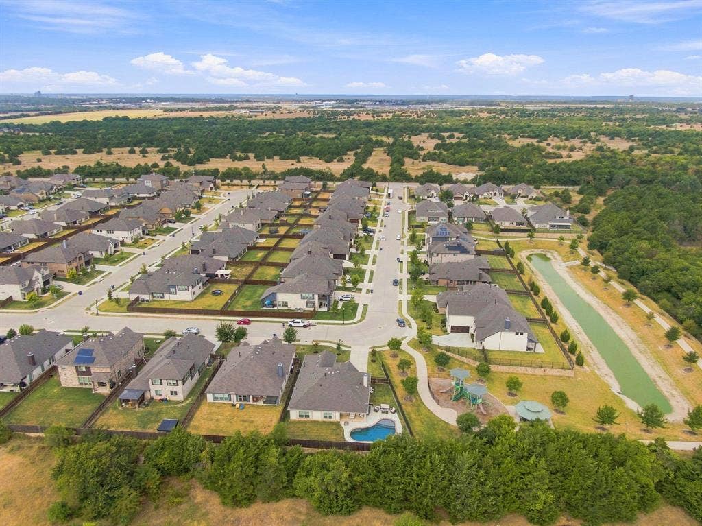 The community walking trail and scenic pond add to the attractiveness of this home