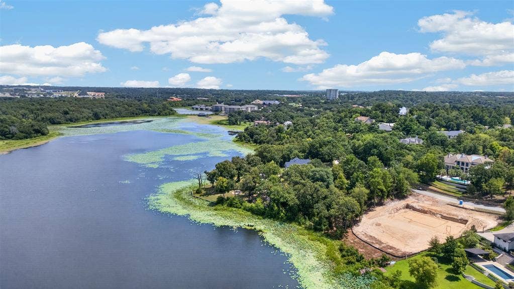 4513 Cascades Shoreline Drive, Tyler, TX 75709 Expansive waterfront, mature tree line, and surrounding landscape