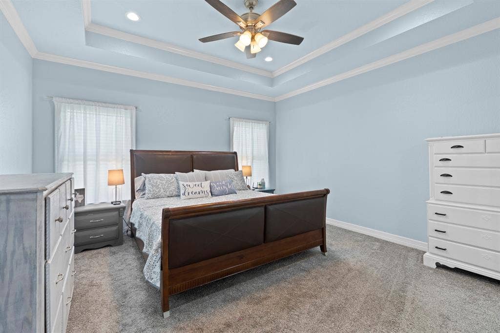 22477 County Road 2166, Troup, TX 75789 Tray ceiling with recessed lighting, ceiling fan, and light-toned wall finishes