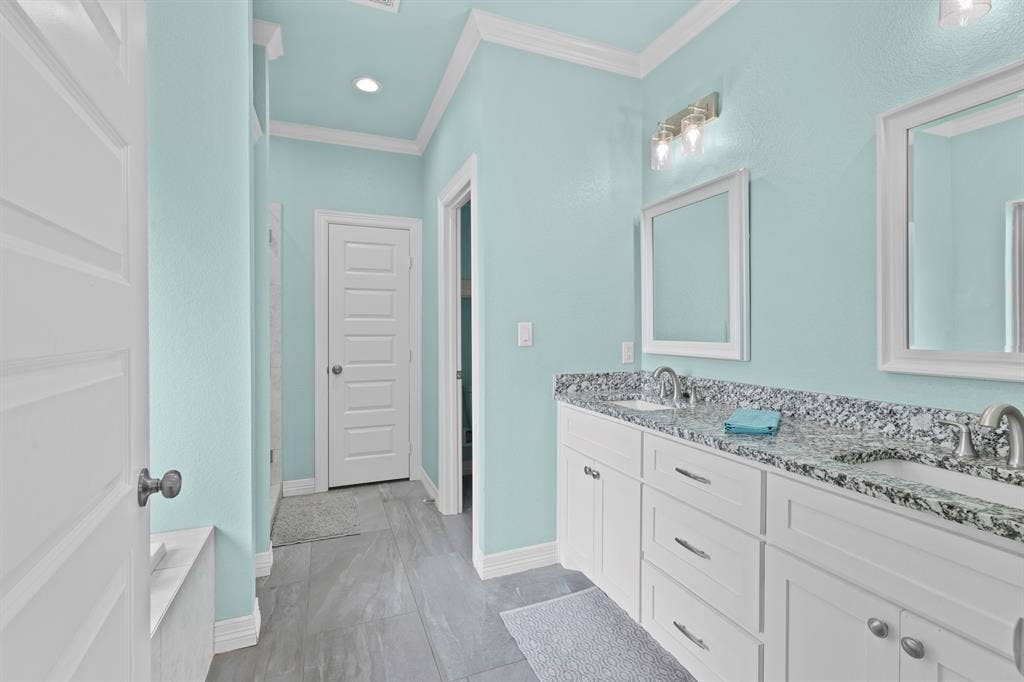 22477 County Road 2166, Troup, TX 75789 Double vanity with undermount sinks and speckled stone countertop