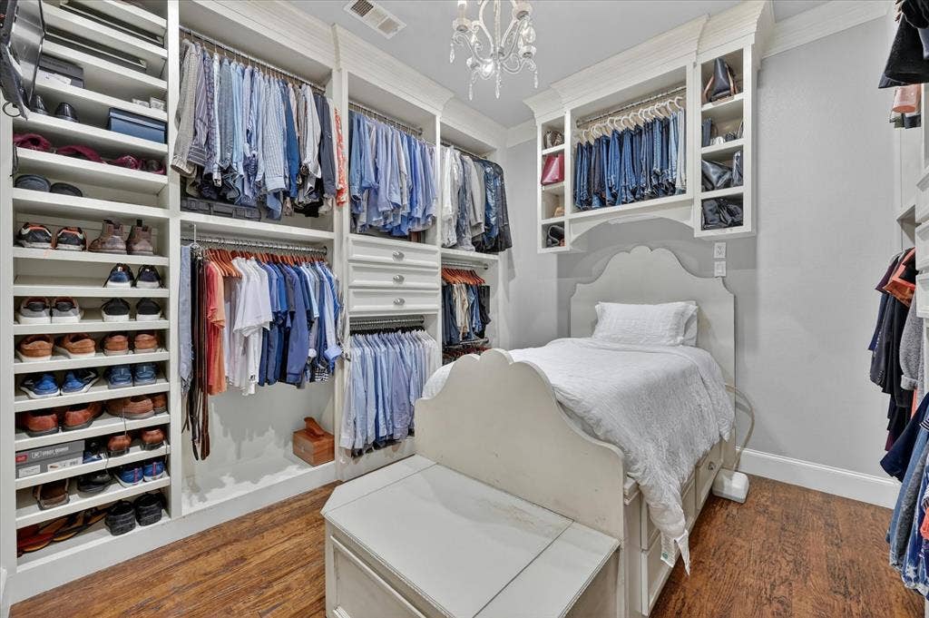 731 Creekwood Drive N, Fairview, TX 75069 Huge primary closet with a custom closet system.
