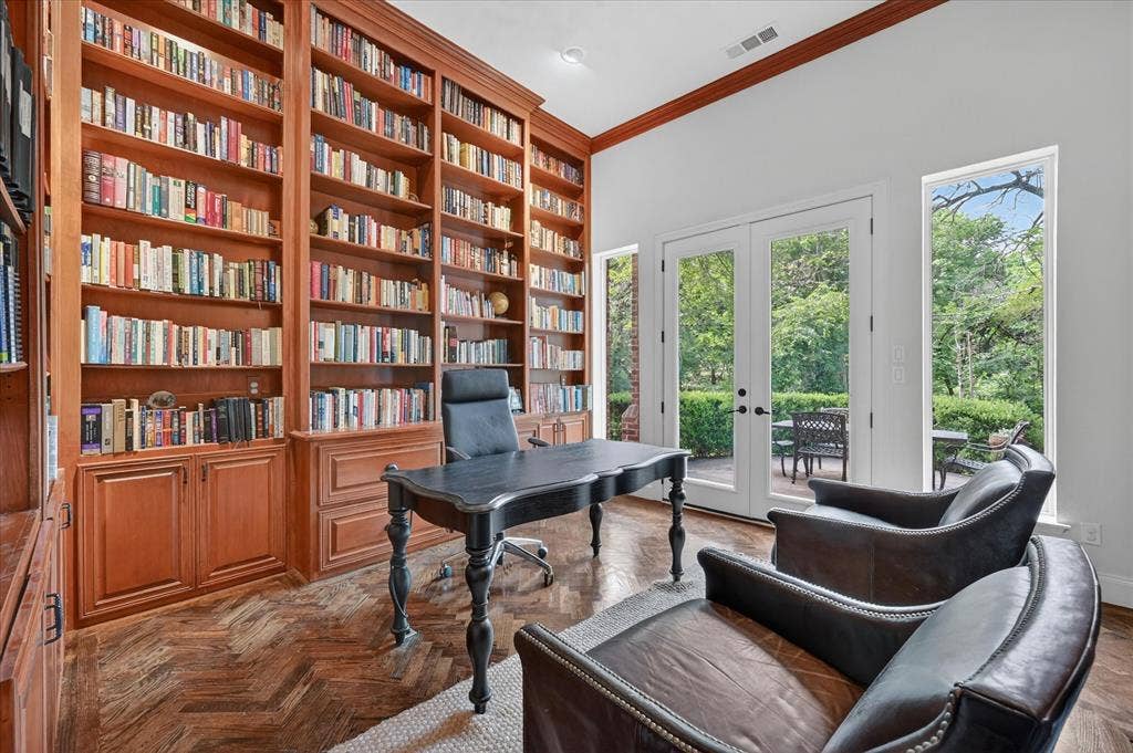 731 Creekwood Drive N, Fairview, TX 75069 Stunning floor to ceiling built-ins, herringbone flooring, fireplace, and private patio access give this office an executive feel!