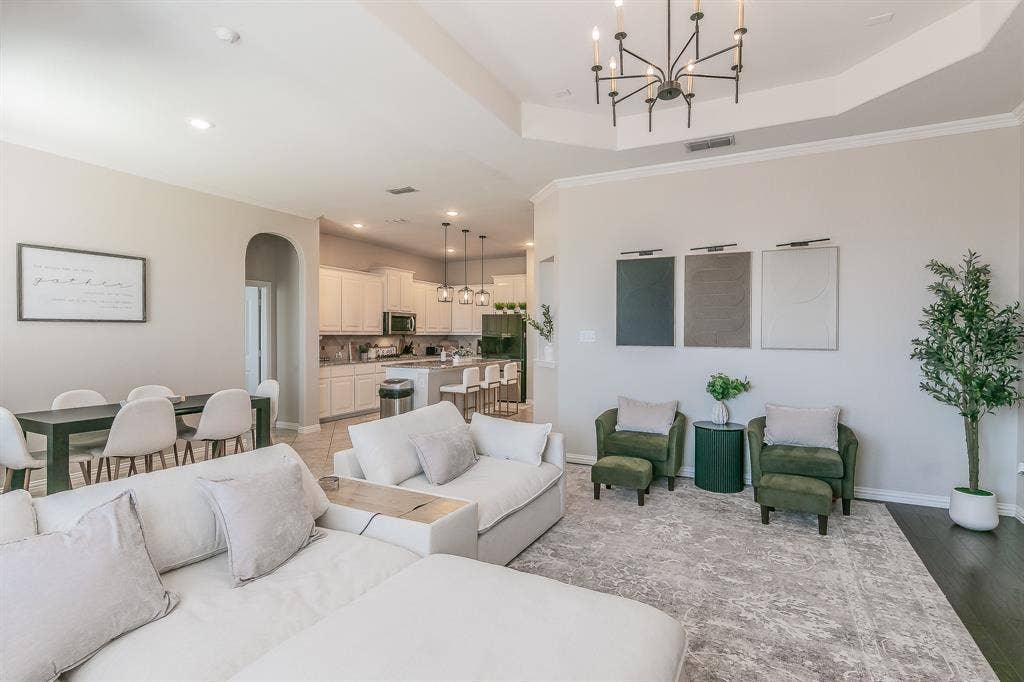 3020 Bella Lago Drive, Fort Worth, TX 76177 Tray ceiling with a contemporary chandelier, recessed lighting, and dark wood-finish flooring