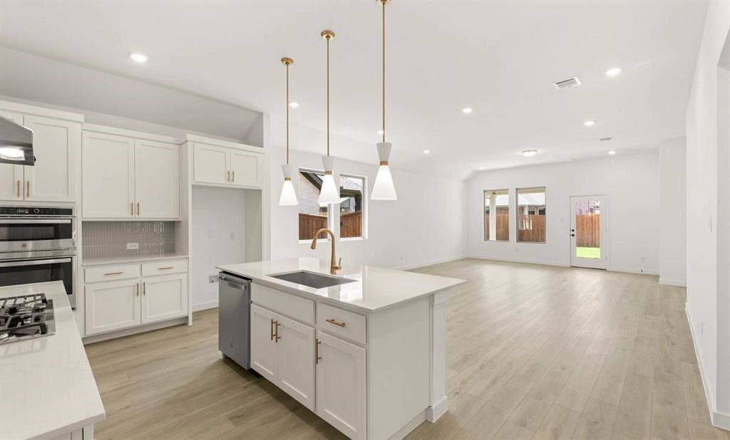 3630 Saffron Drive, Celina, TX 75009 Open Kitchen-Living-Dining Room featuring the Serene Collection