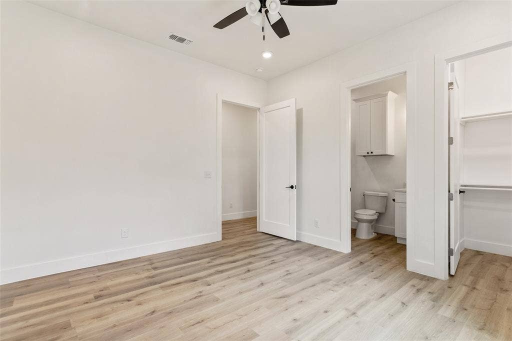 Wood-finish flooring, recessed lighting, and a ceiling fan