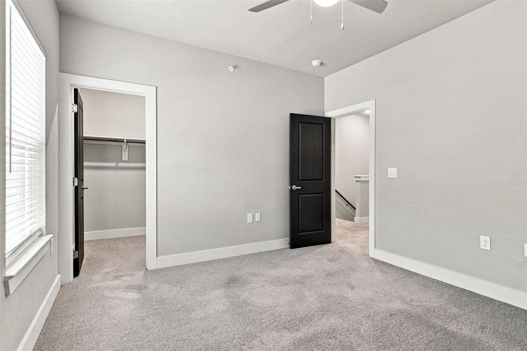 3352 Norris Street, Plano, TX 75074 Light gray walls, light gray carpeting, white trim, and a ceiling fan with integrated lighting