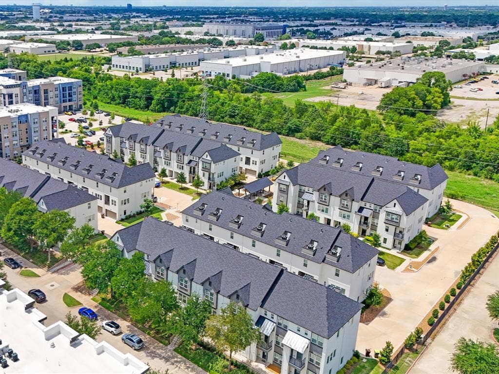 3352 Norris Street, Plano, TX 75074 Contemporary townhome architecture featuring dark shingle roofing and light-colored siding