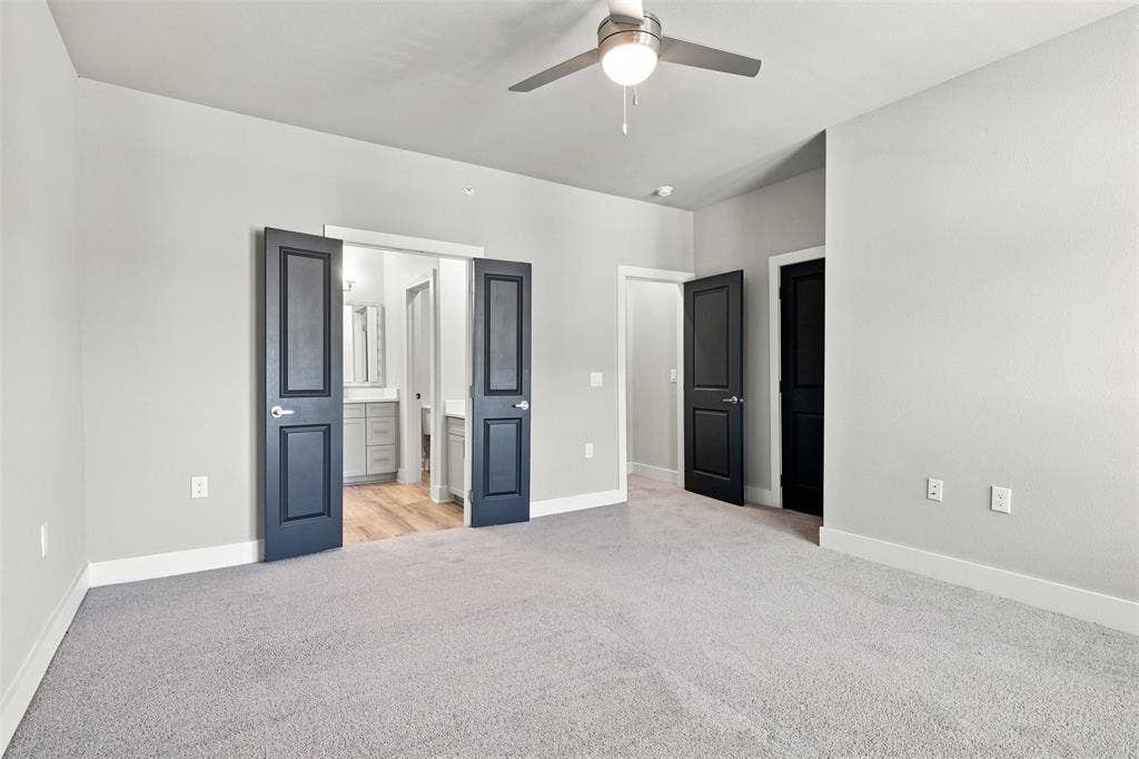 3352 Norris Street, Plano, TX 75074 Neutral wall paint, ceiling fan, carpet flooring, double doors, and recessed lighting
