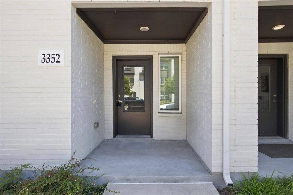 3352 Norris Street, Plano, TX 75074 Entryway with a dark-framed door, adjacent vertical window, and an overhead recessed light