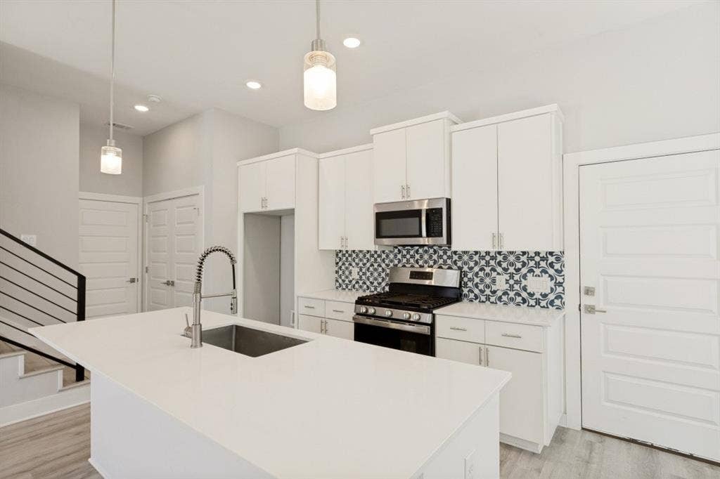 1042 Rosemont Street, #1, Austin, TX 78723 Kitchen island with an undermount sink and gooseneck faucet
