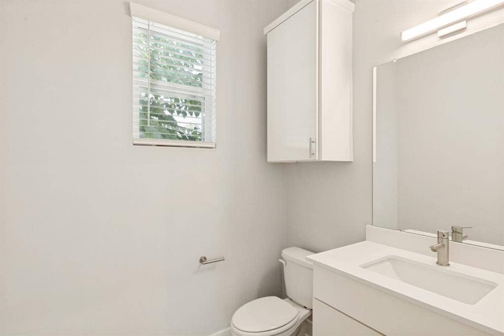 1042 Rosemont Street, #1, Austin, TX 78723 White vanity with a rectangular undermount sink and brushed nickel faucet