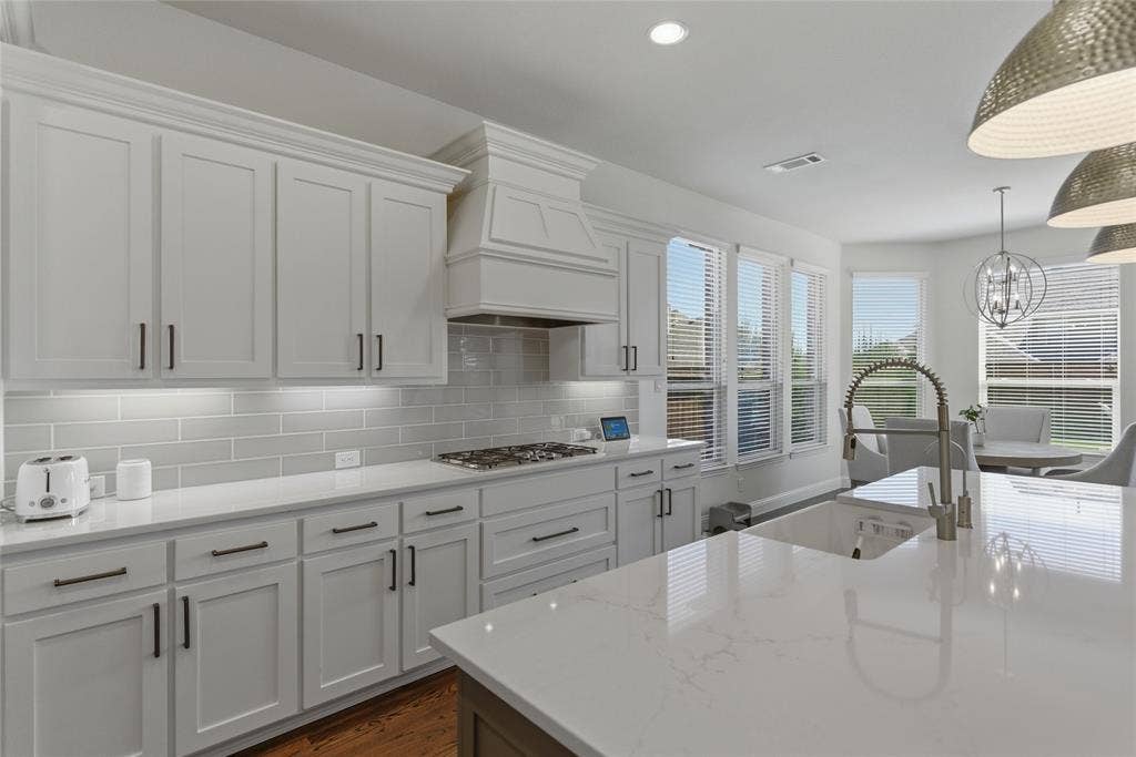 2801 Seabiscuit Road, Celina, TX 75009 Large island, white cabinets and designer backsplash