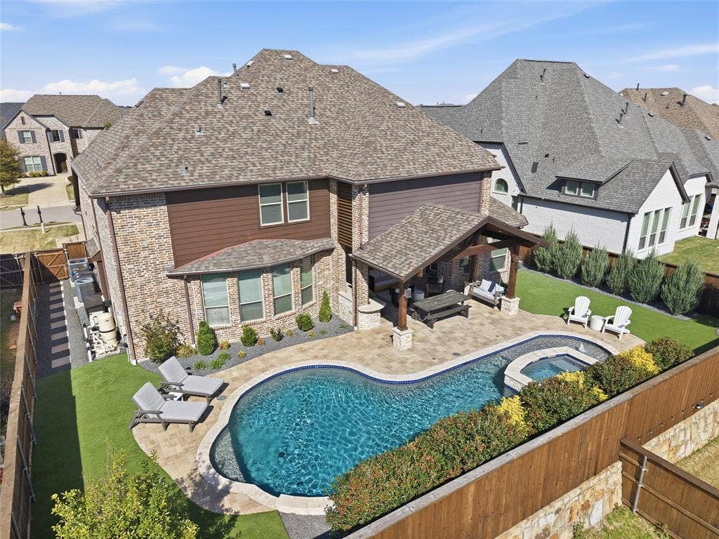 2801 Seabiscuit Road, Celina, TX 75009 Enjoy outdoor living with sparkling pool, spa and covered patio