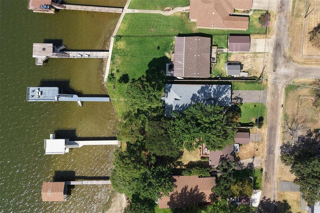 109 Briarwood Drive, Gun Barrel City, TX 75156 Waterfront property featuring multiple private docks and mature trees