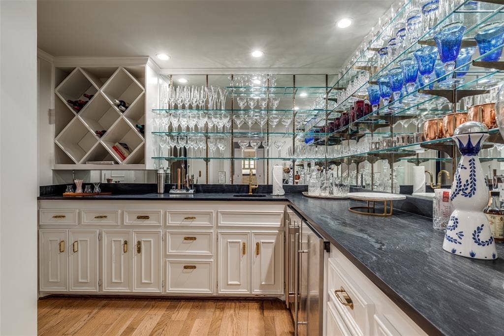 17316 Club Hill Lane, Dallas, TX 75248 Sophisticated wet bar with ice maker, wine and beverage frig, storage closet and extra refrigerator for all your cocktail staples