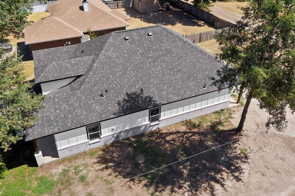 102 Redondo Drive, Gun Barrel City, TX 75156 Gray shingle roof, white siding, and gray brick veneer