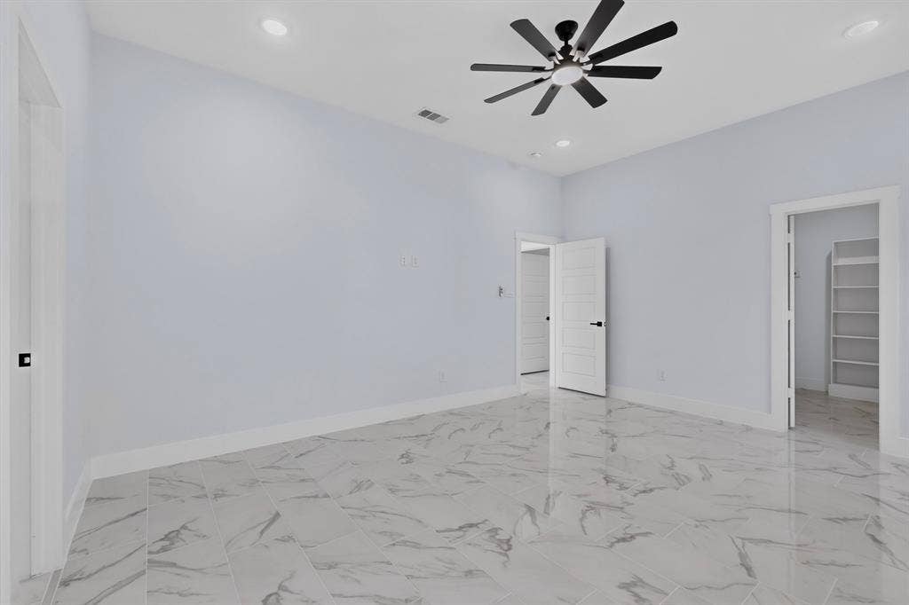 102 Redondo Drive, Gun Barrel City, TX 75156 Recessed lighting, ceiling fan with black blades, and marble-finish flooring