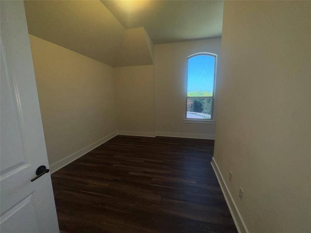 1701 Shamrock Green, Mesquite, TX 75181 Wood-finish flooring, arched window, and tray ceiling