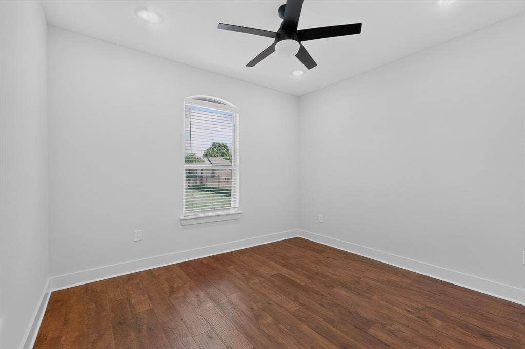 1672 Brookview Drive, Lancaster, TX 75146 Recessed lighting, wood-finish flooring, and a modern ceiling fan with a matte black finish