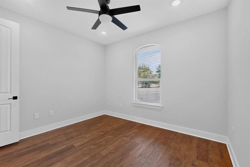 1672 Brookview Drive, Lancaster, TX 75146 Wood-finish flooring, recessed lighting, and a modern ceiling fan