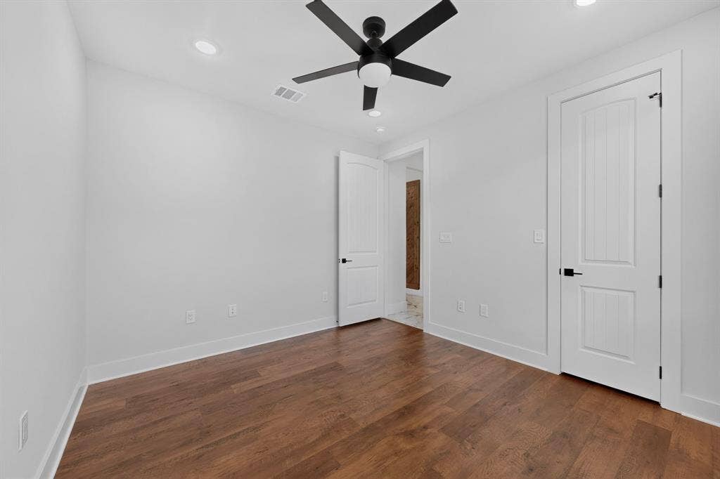 1672 Brookview Drive, Lancaster, TX 75146 Wood-finish flooring, recessed lighting, and a ceiling fan with integrated lighting