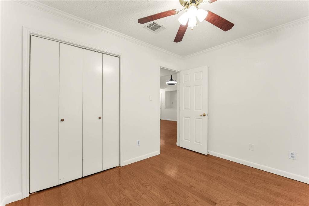 4626 Lexington Street, Bellmead, TX 76705 Hardwood-style flooring throughout with a ceiling fan light fixture and bi-fold closet doors