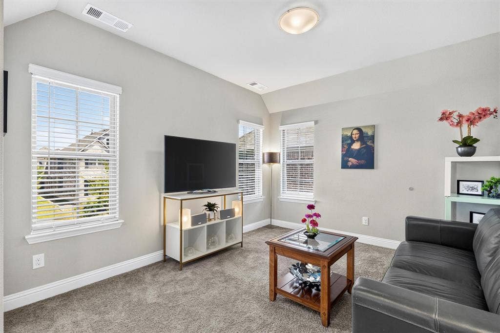 8226 Natchez Trail, Dallas, TX 75252 Carpeted flooring, vaulted ceiling, recessed lighting, multiple windows with blinds