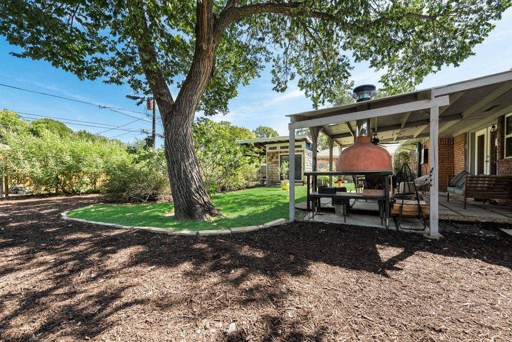 529 Carol Court, Richardson, TX 75081 This backyard was built to host get-togethers - covered patio, pizza oven and room for pets and kids to play.