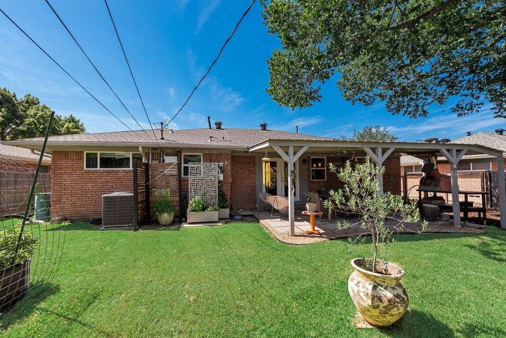 529 Carol Court, Richardson, TX 75081 This backyard was built to host get-togethers - covered patio, pizza oven and room for pets and kids to play.