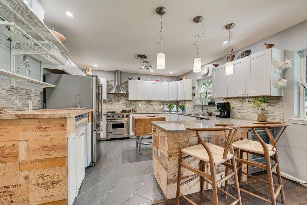 529 Carol Court, Richardson, TX 75081 Updated kitchen has ample storage, a breakfast bar, stainless steel appliances and a wine fridge.