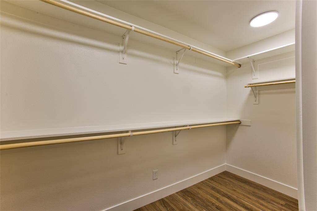 View Into Spacious Primary Suite Closet
