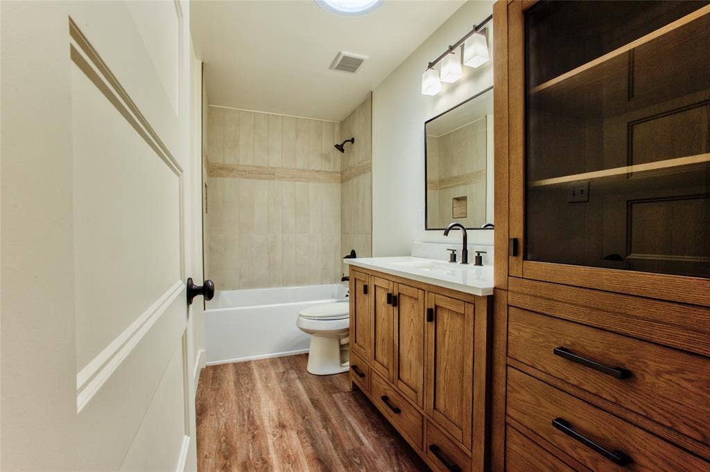 All New Cabs, Vanity, Counters, Sink, Tub wCeramic Tile Enclossure & Fixtures, LVP wContemporary Lighting