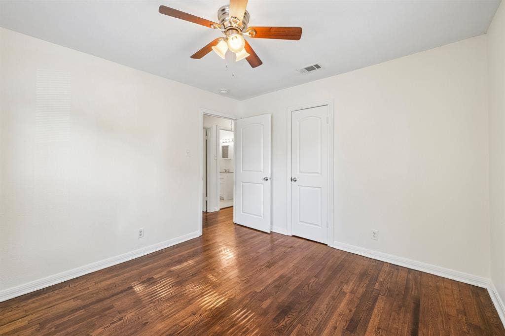 5012 Pamela Drive, Fort Worth, TX 76116 Hardwood flooring, crisp white walls, and a ceiling fan with integrated lighting