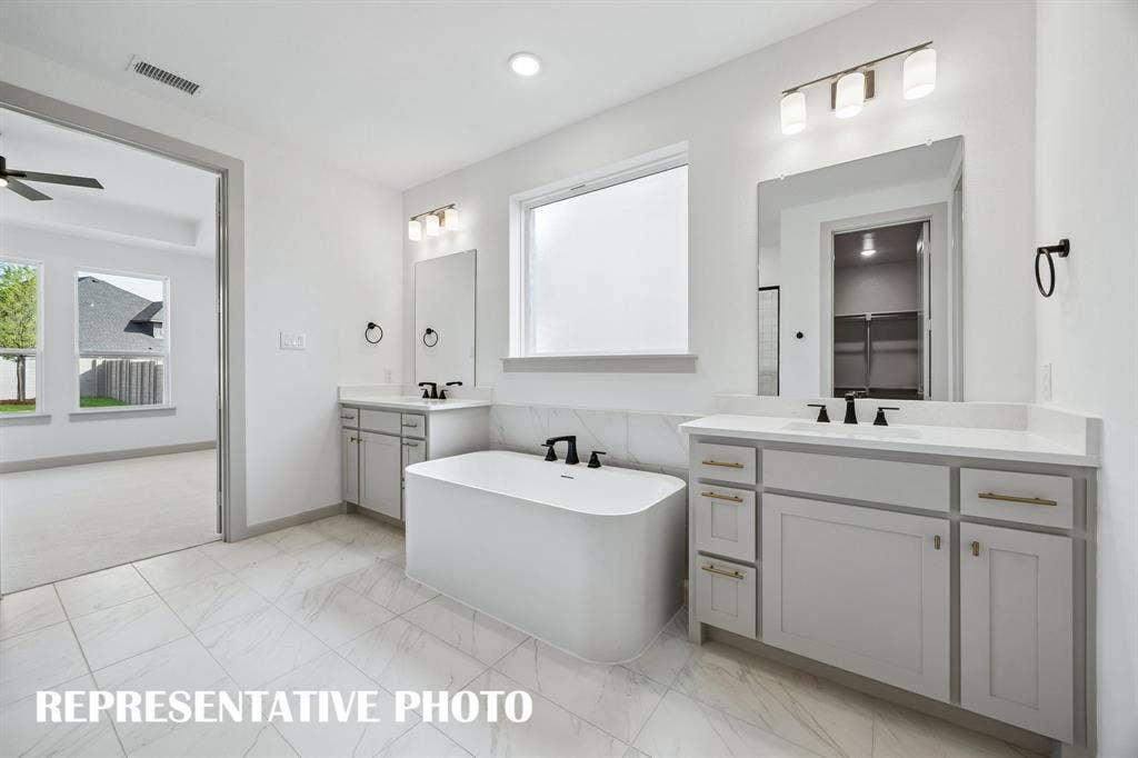 2629 Radiant Way, Celina, TX 75009 An owner's bath designed for two! REPRESENTATIVE PHOTO