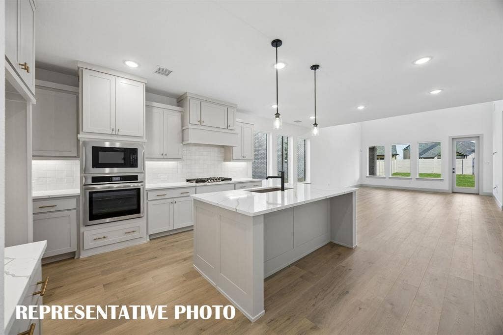 2629 Radiant Way, Celina, TX 75009 This chef's dream kitchen offers outstanding storage and prep space so all the chef's in the family can create together! REPRESENTATIVE PHOTO