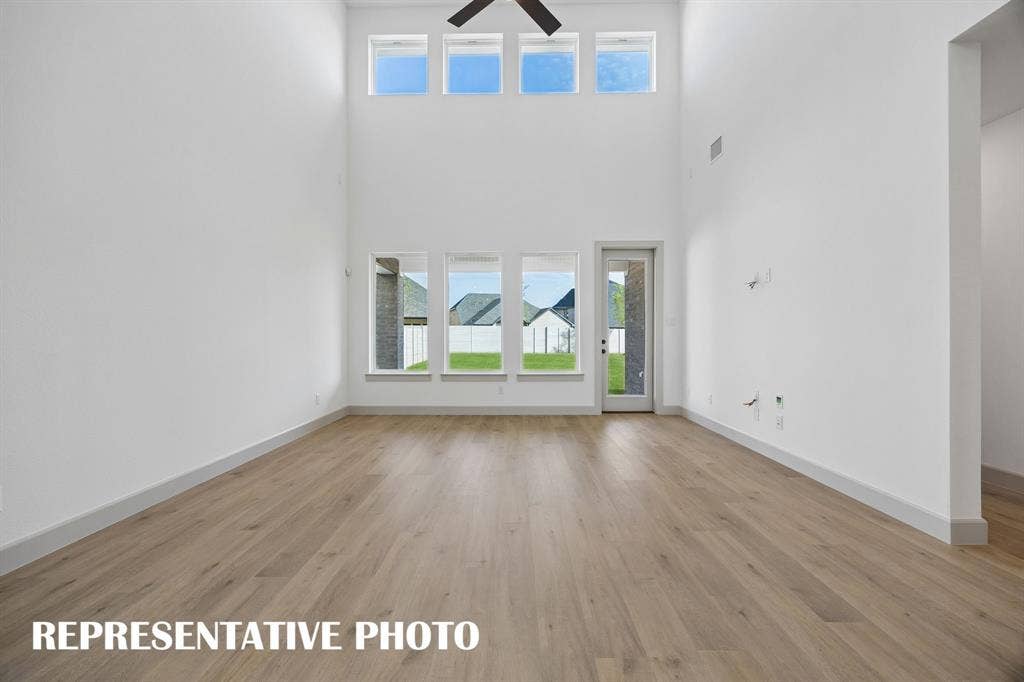 2629 Radiant Way, Celina, TX 75009 Light filled and offering a peaceful backyard view, you will love hosting family and friends in this wonderful family room. REPRESENTATIVE PHOTO