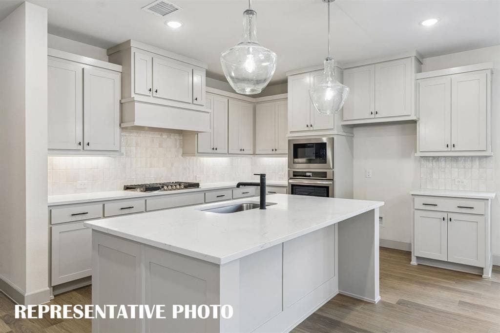 2625 Radiant Way, Celina, TX 75009 This outstanding kitchen offers ample space for all the chef's in the family to create! REPRESENTATIVE PHOTO